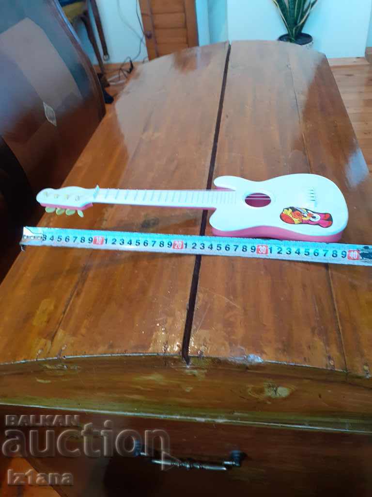 Delivery of Old children's guitar