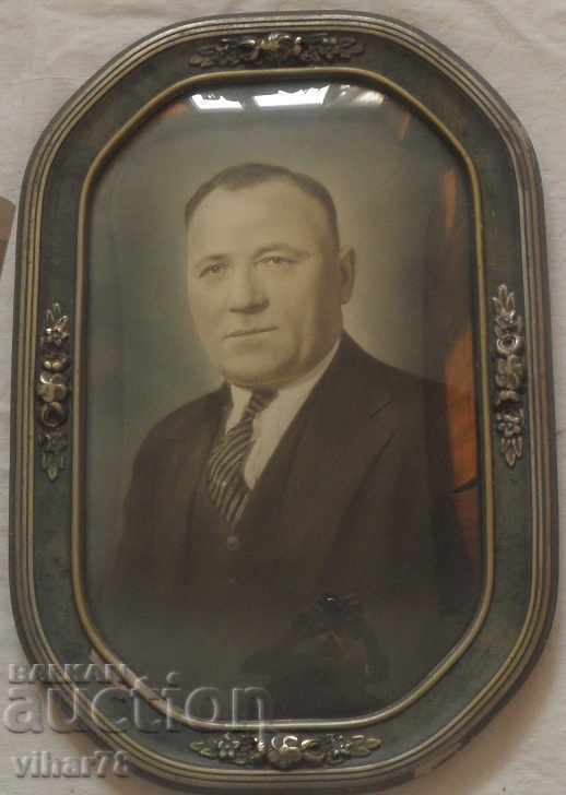 Old large photo in a wooden frame