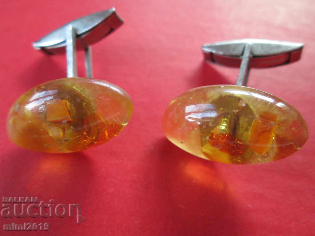 Old pistols, sleeves, amber Old pistols, sleeves, amber