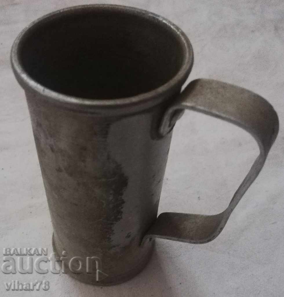 An old measure of alcohol with stamps - 5 An old measure of alcohol with stamps - 5