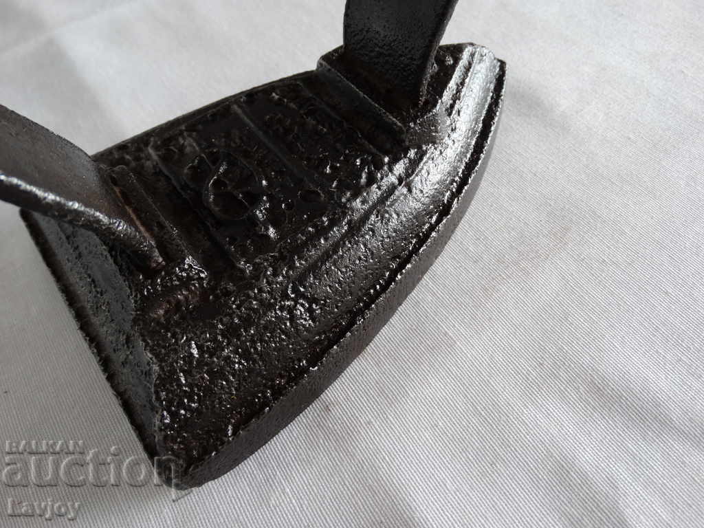 Auction  A rare collectible iron