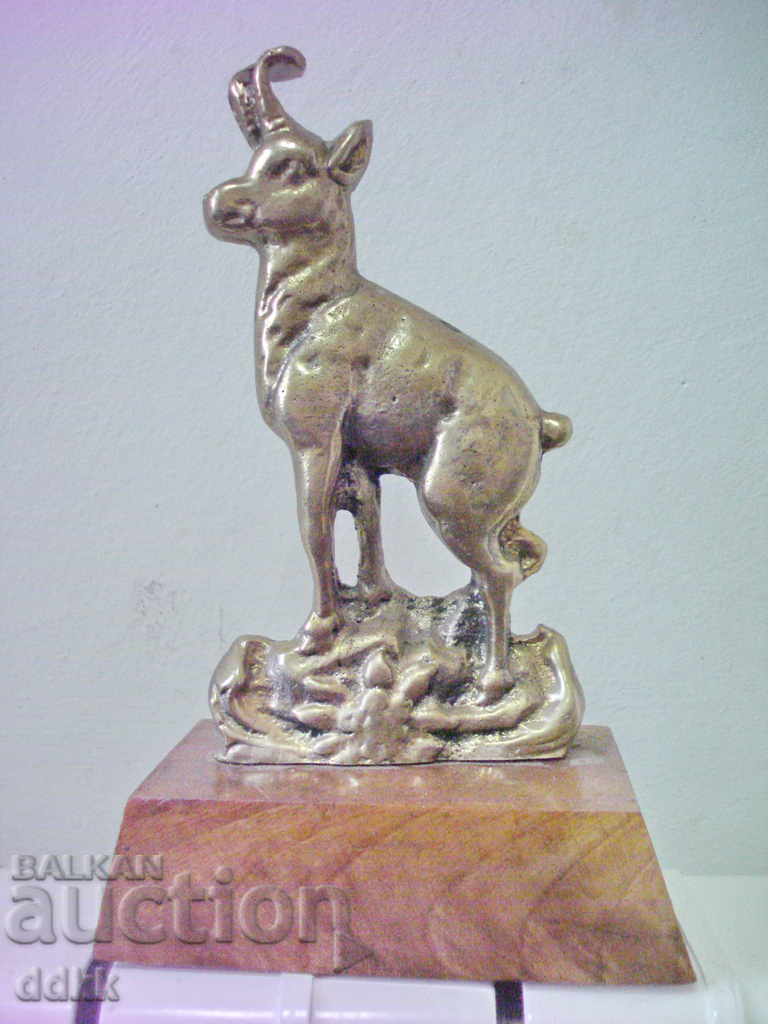 Old bronze statuette with a goat