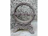 Stand made of figured cast iron stand for clock rock emblem