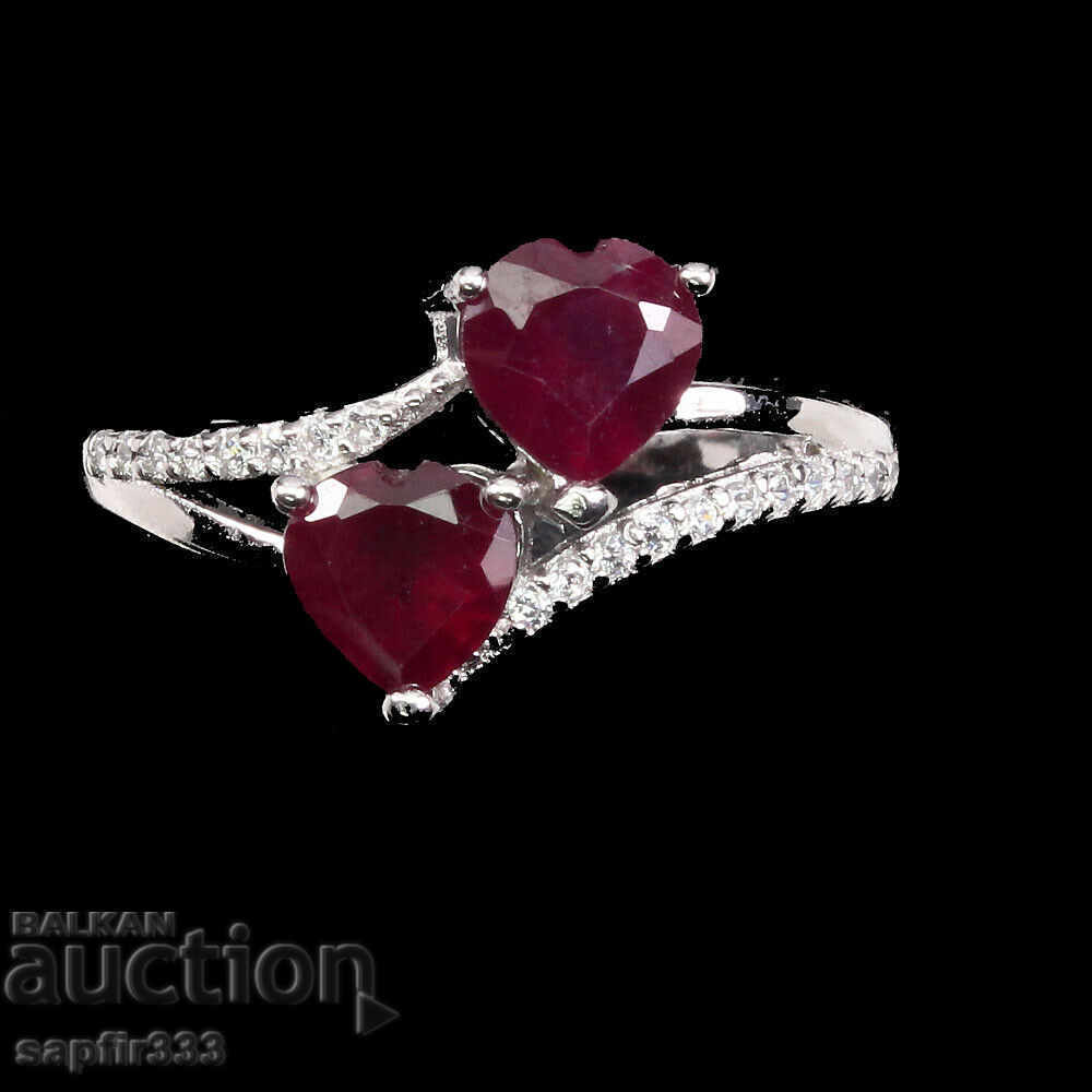 Auction  HEADS OF EXCELLENT DESIGNER RING WITH RUBY