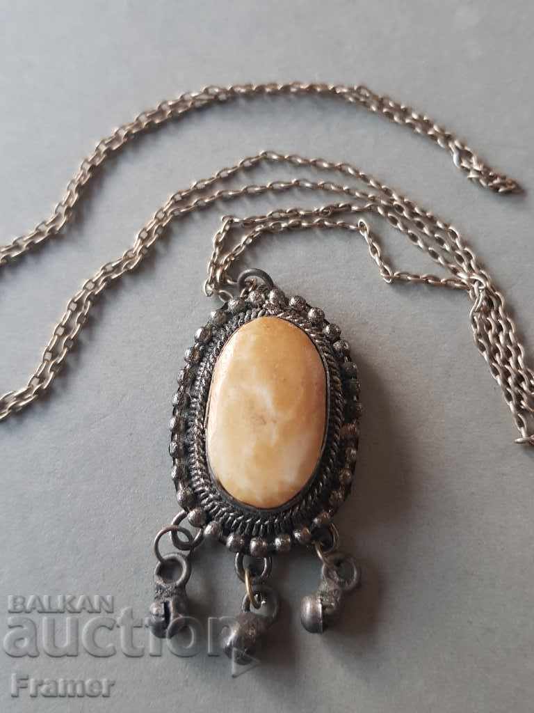 Auction  Old silver silver medallion with bone ornament