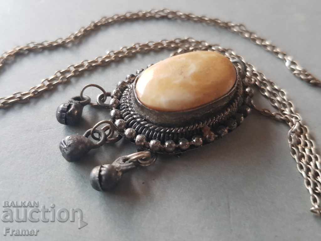 Delivery of Old silver silver medallion with bone ornament