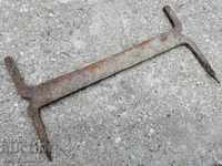 Old forged scraper, wrought iron, primitive