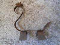 Old forged metal candlestick