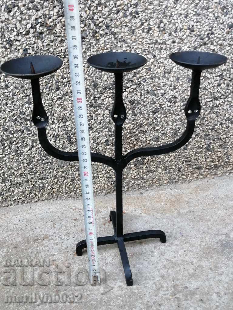 Delivery of Old forged candlestick, candle, candelabra
