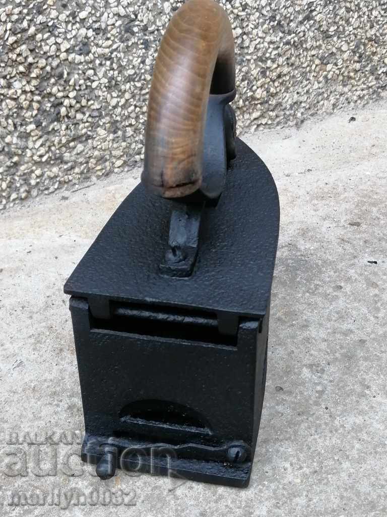 Auction  An old iron on fire