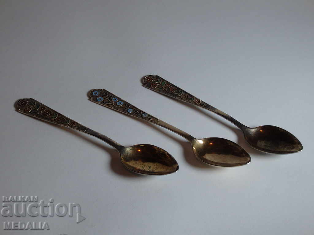 An old Russian set of 3 gilded silver spoons with enamel