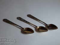 An old Russian set of 3 gilded silver spoons with enamel