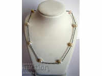 Gentle necklace with natural river pearls and medical steel