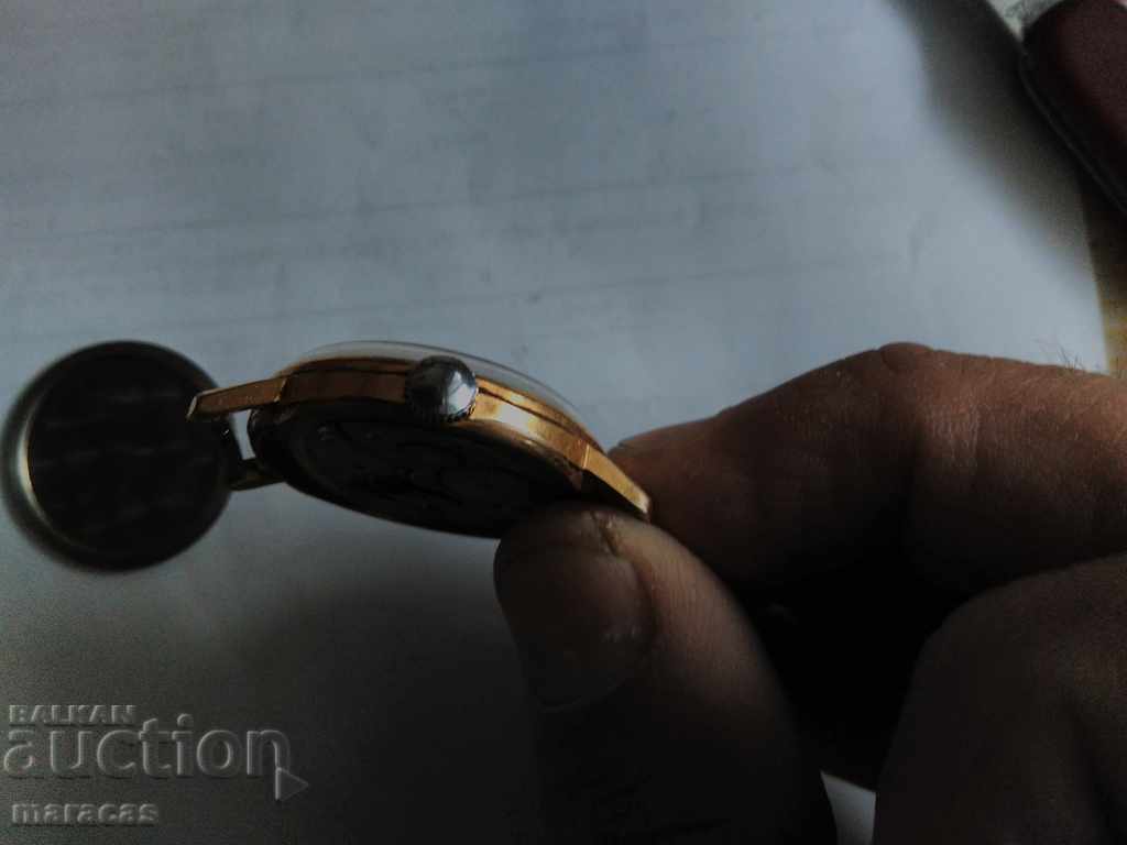 Delivery of Vostok watch with gilded frame Delivery of Vostok watch with gilded frame