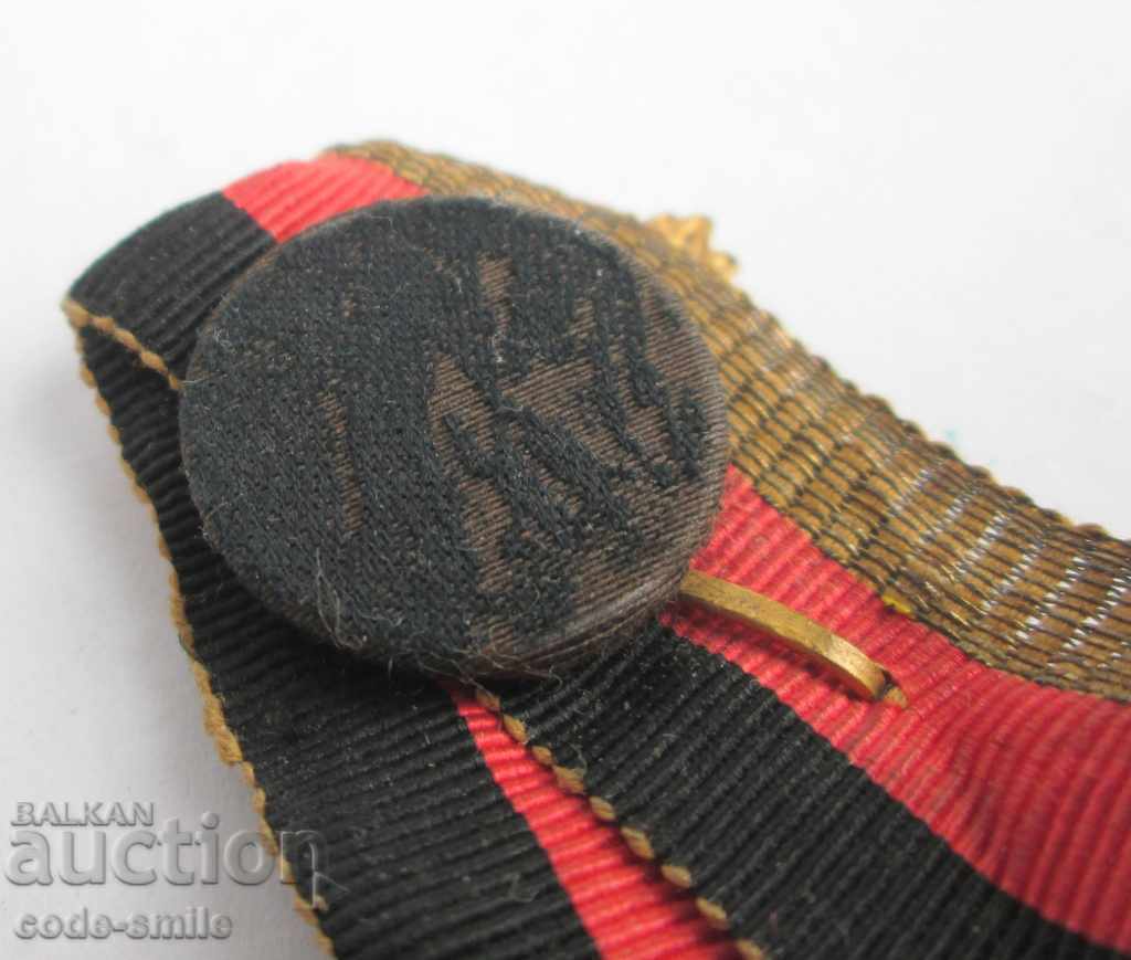 Delivery of Old musical badge sign from the 19th century brooch with ribbon and tinsel Delivery of Old musical badge sign from the 19th century brooch with ribbon and tinsel