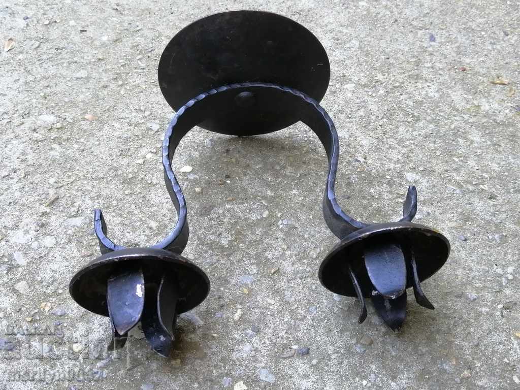 Auction  An old candle made of wrought iron lamp