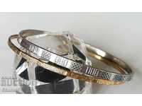 TWO OLD HARD BRACELETS - SILVER AND GOLD