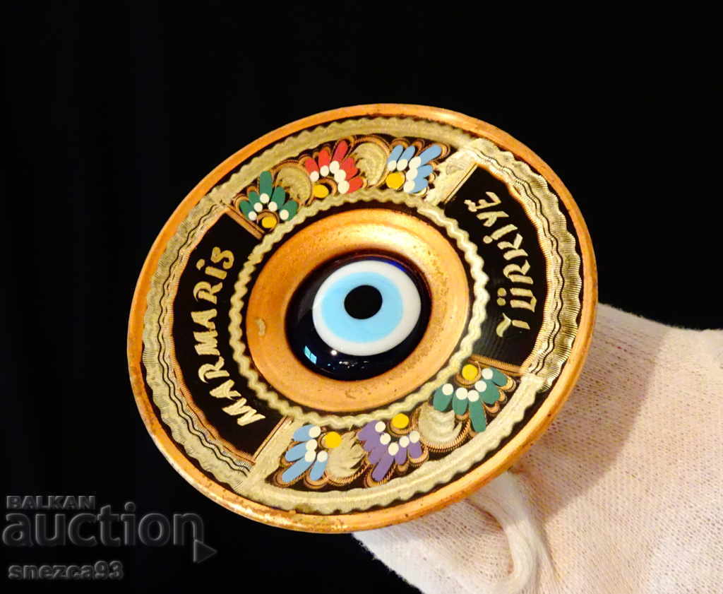 Copper plate with a blue eye, painted. Copper plate with a blue eye, painted.