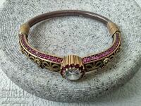 Silver bracelet with rubies and a large beautiful stone