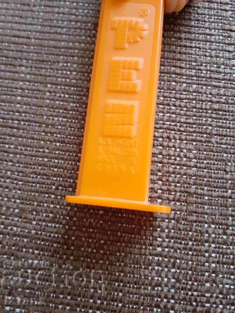 Delivery of Piece of PEZ candy