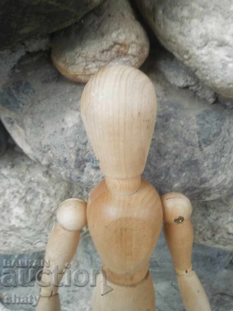 Delivery of A wooden man with hinges.