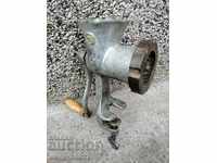 An old metal grinder for meat grinders
