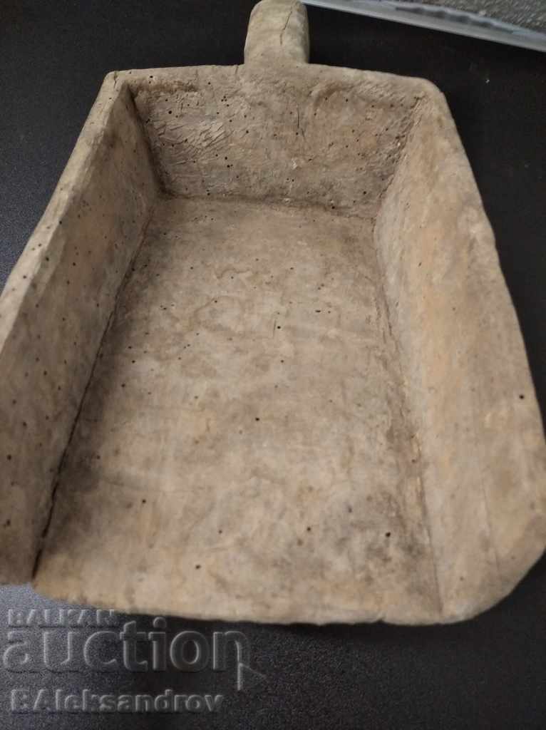 Delivery of An old wooden shovel