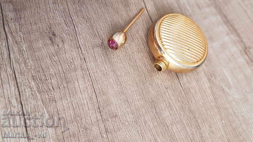 Auction  An old perfume bottle