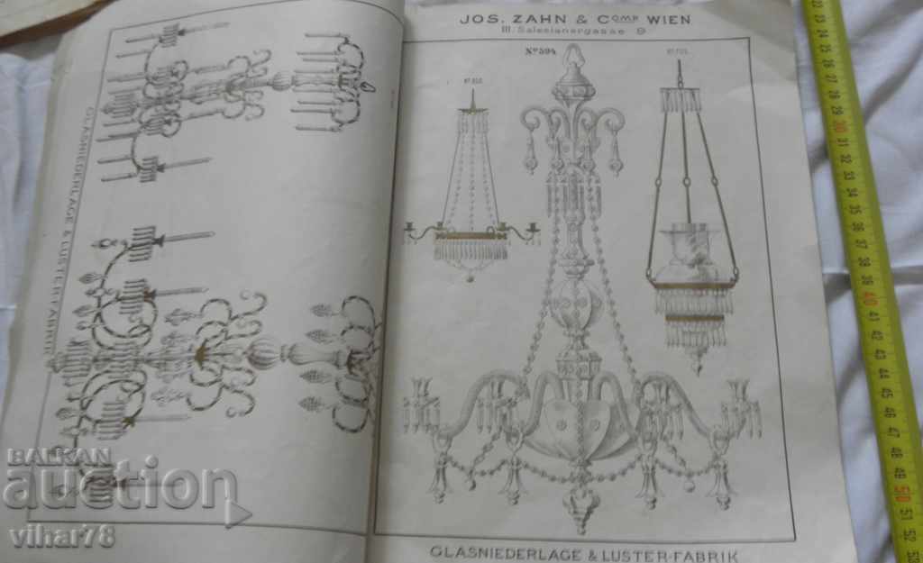 Delivery of Old catalog-magazine behind the chandelier Delivery of Old catalog-magazine behind the chandelier