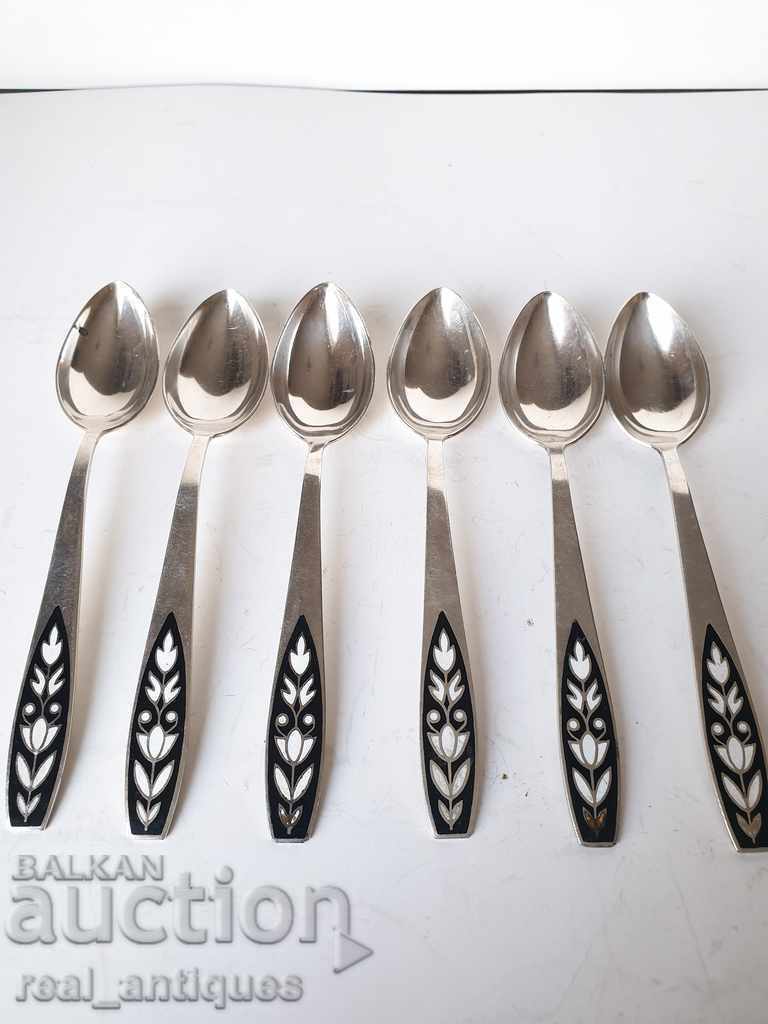 Old silver plated spoons with enamel