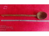 Old large wooden spoon ladle