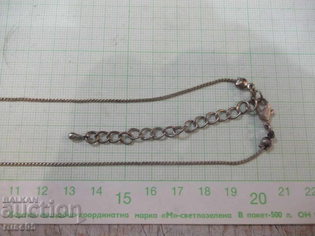 Auction Chain with three balls with stones Auction Chain with three balls with stones