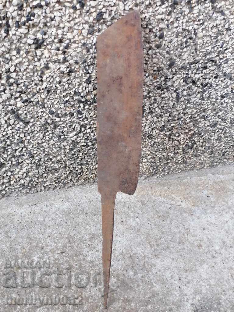 Old forged scythe, ax, hoop, knife, machete, blade