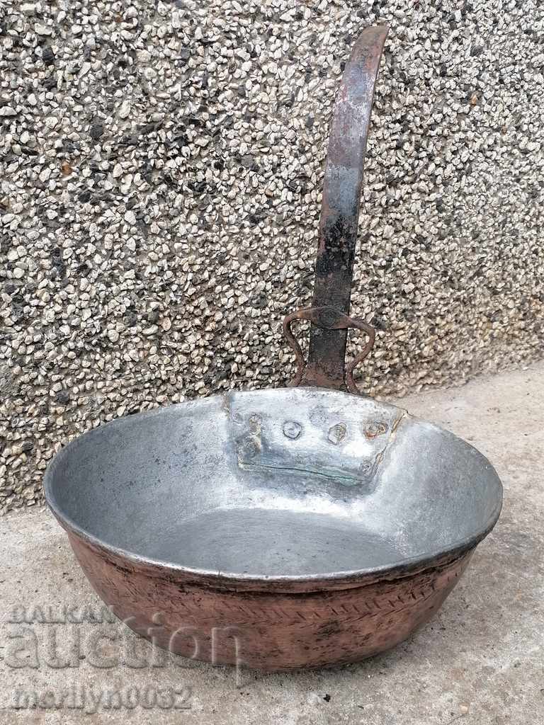 An old copper pan, a baker, a tray, a copper pot