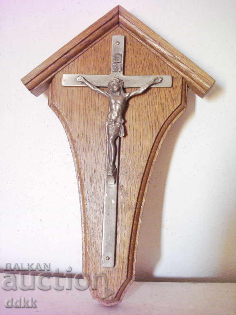 Old cross with a wooden stand