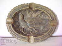 Old bronze ashtray with bird