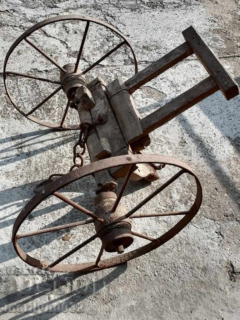 Agricultural tool for hanging a wrought iron harrow