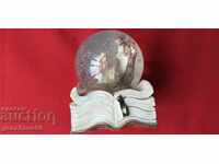 Glass paperweight ball, book