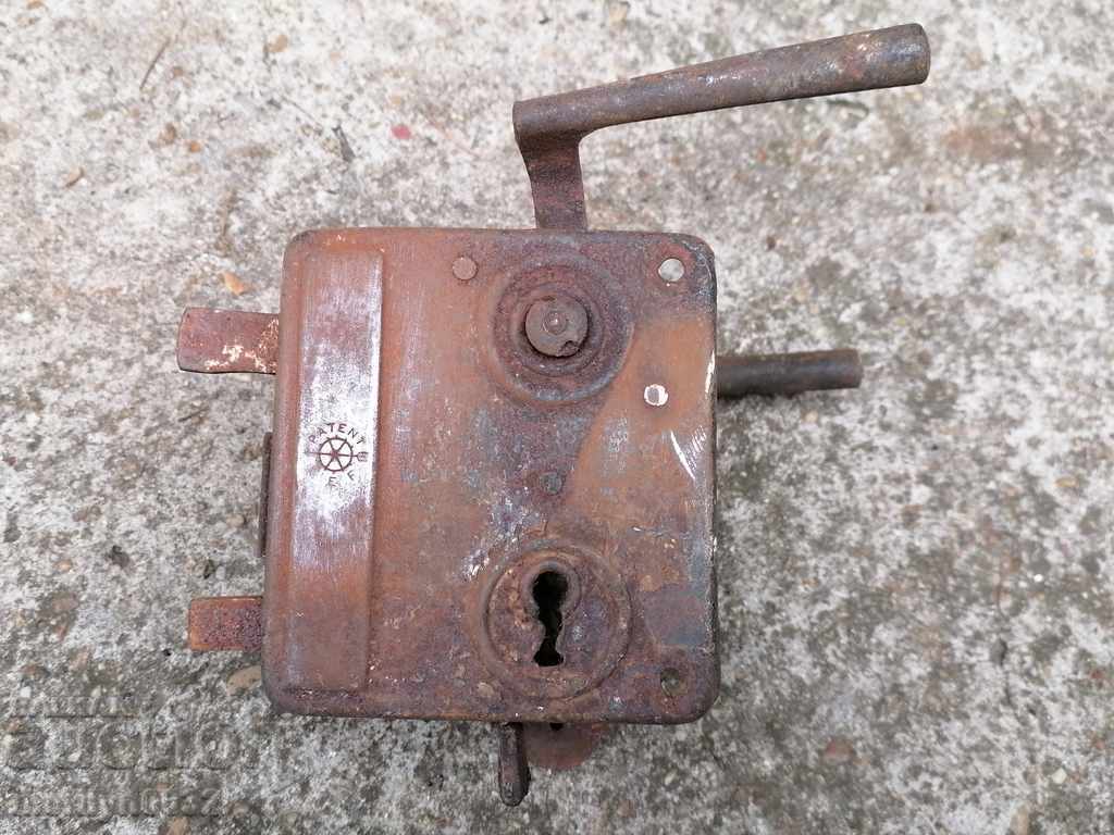Old lock without a key, latch from the beginning of the 20th century Old lock without a key, latch from the beginning of the 20th century
