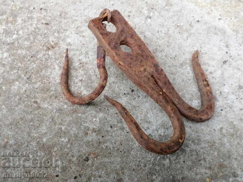 Delivery of An old forged hook for scraping, a cock, anchor Delivery of An old forged hook for scraping, a cock, anchor