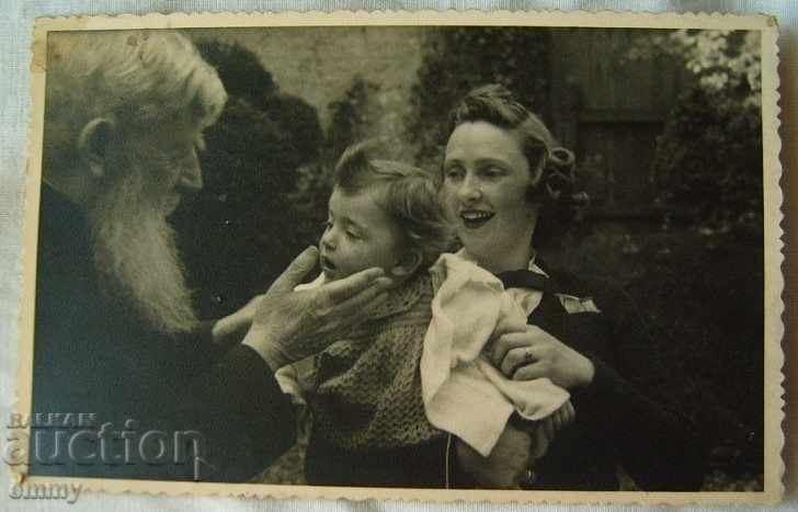 Old photo pop priest, mother with child