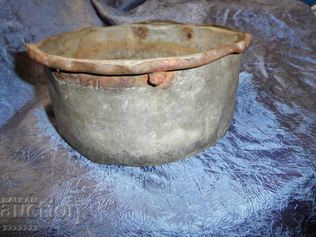 old copper pot with inscription