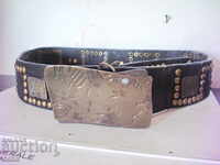Old belt with brass