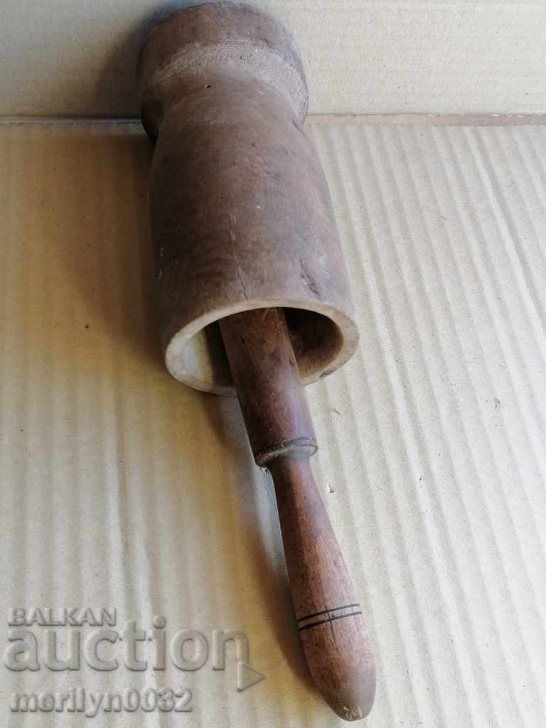 Auction  An old wooden mortar with hammer, mortar, chute, wooden
