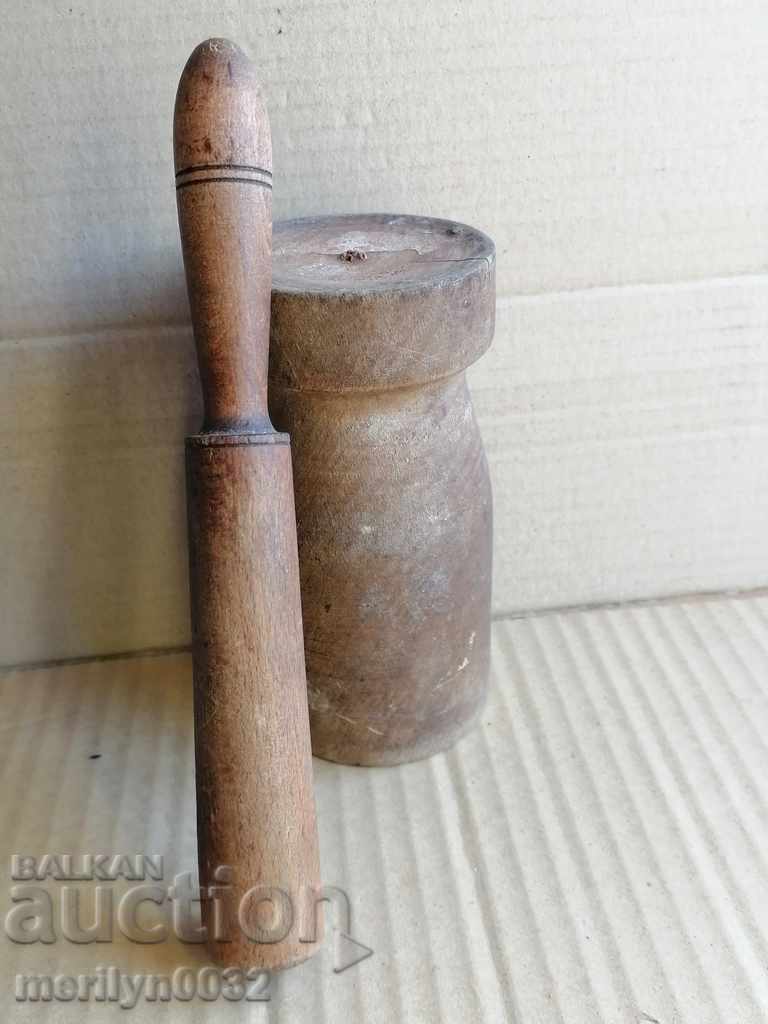 Delivery of An old wooden mortar with hammer, mortar, chute, wooden