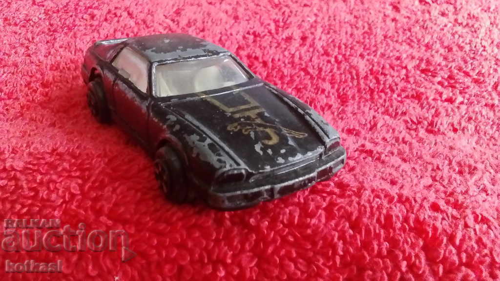 Delivery of Old small metal Jaguar car Delivery of Old small metal Jaguar car