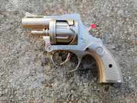 Old toy revolver with eyelets Works