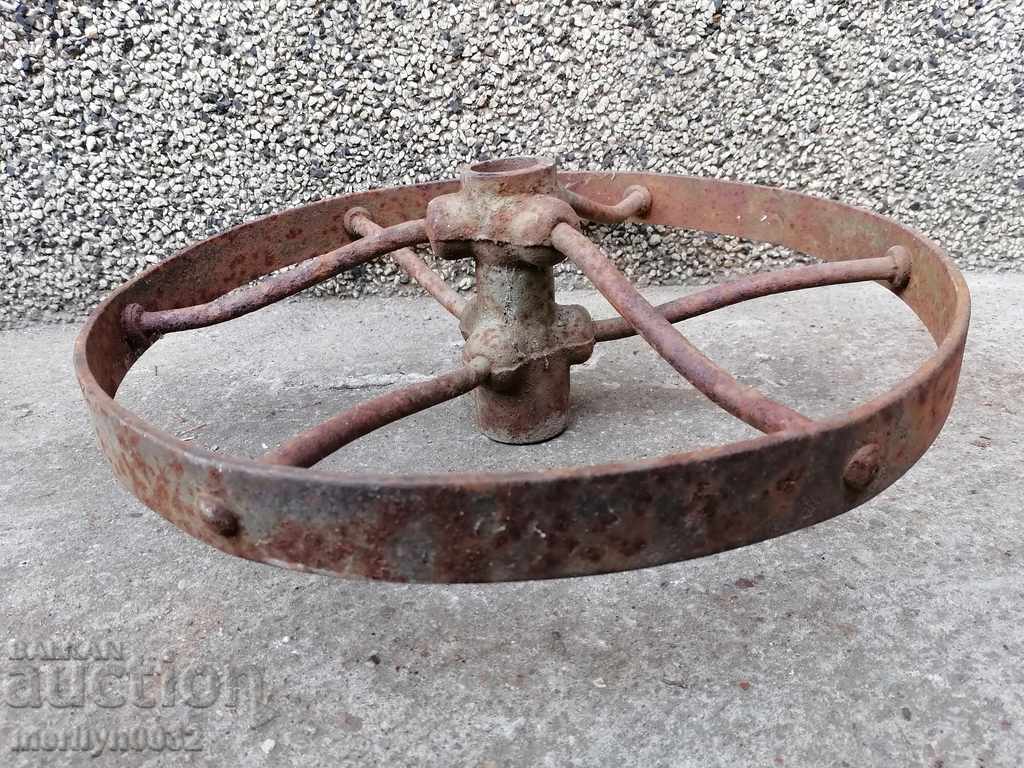 Auction A pair of forged iron wheels Auction A pair of forged iron wheels