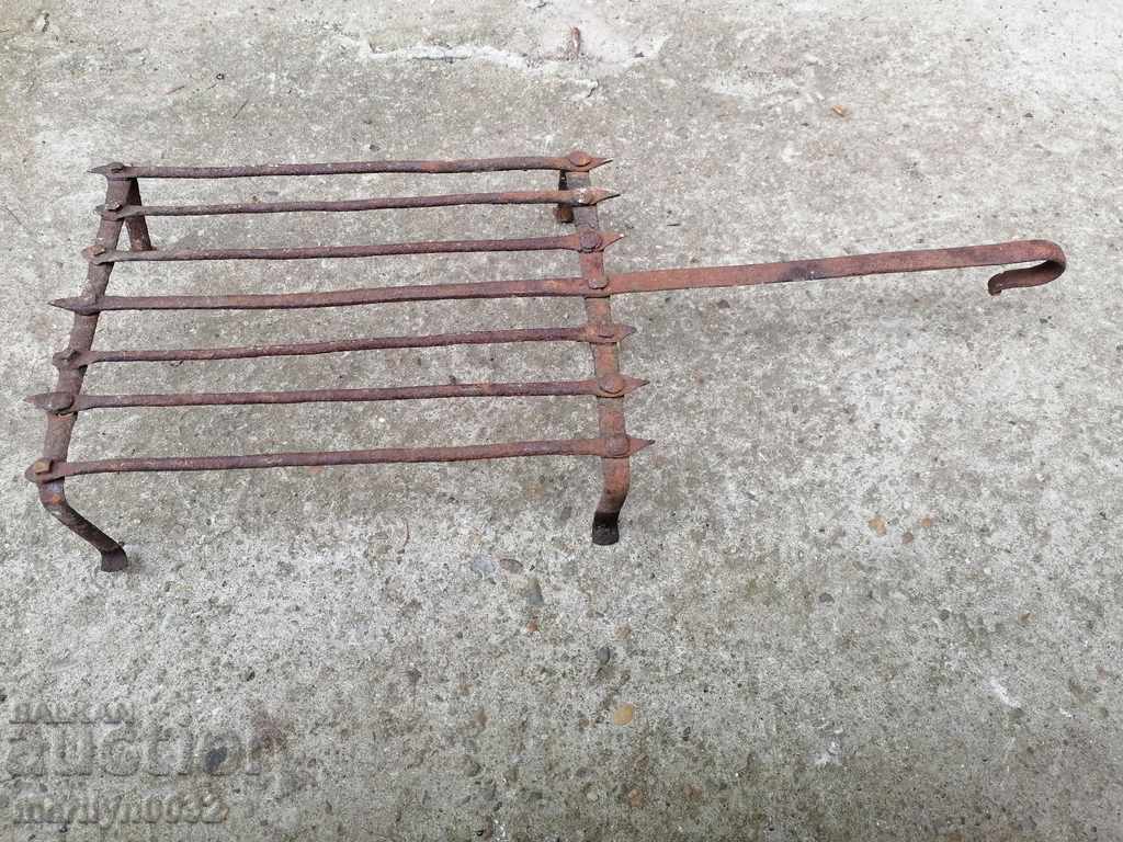 Delivery of An old hand-forged grill, a steak, wrought iron Delivery of An old hand-forged grill, a steak, wrought iron