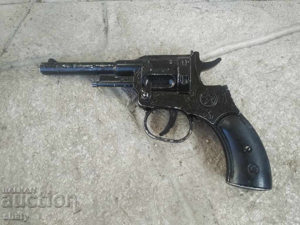 Old pistol with a caps tape.